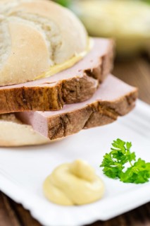 Leberkaese on a vintage background as detailed close-up shot (selective focus)