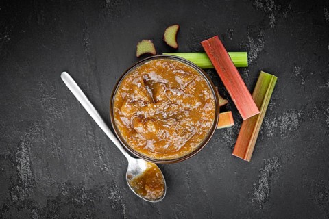 Homemade Rhubarb Jam on rustic background (close up shot, selective focus)
