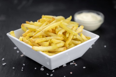 Portion of fresh made crispy French Fries (selective focus, close-up shot)