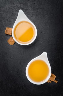 Syrup (Caramel taste) on a vintage slate slab (close-up shot, selective focus)