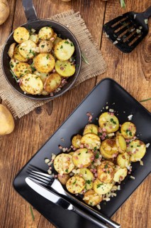 Portion of fresh made Fried Potatoes (selective focus, close-up)