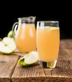 Fresh made Juice (apple) on a vintage background (close-up shot)