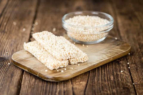 Portion of homemade Quinoa Bars (selective focus, close-up shot)