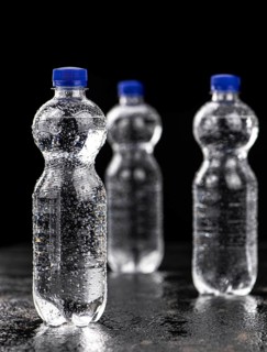 Bottles of chilled sparkling water as detailed close up shot
