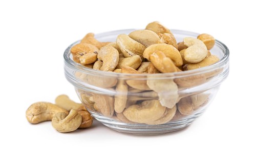 Cashew Nuts isolated on white background (close up shot, selective focus)
