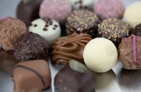 Portion of mixed Pralines as detailed close-up shot