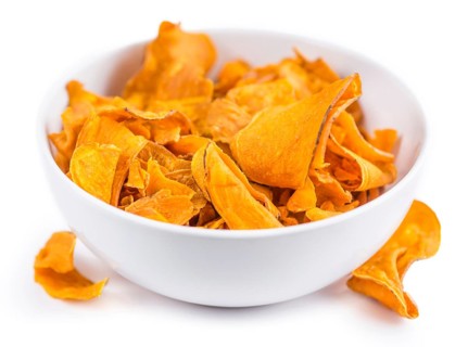 Portion of Sweet Potato Chips as detailed close-up shot isolated on white background