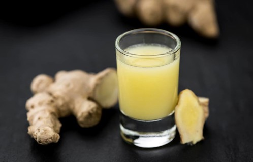 Portion of fresh Ginger Juice (selective focus, close-up shot)