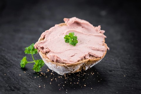 Liverwurst Sandwich on a vintage background as detailed close-up shot (selective focus)
