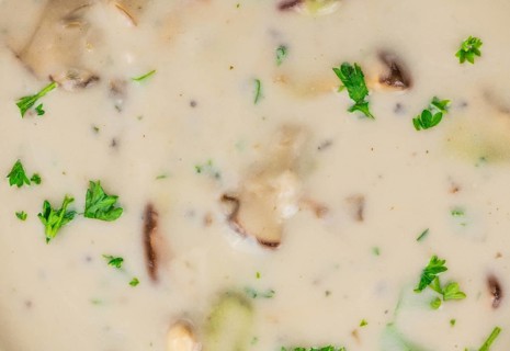 Homemade Porcini Soup on vintage background selective focus, close-up shot