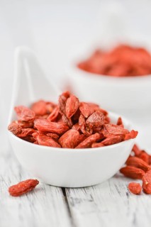 Goji Berries on a vintage background as detailed close-up shot (selective focus)