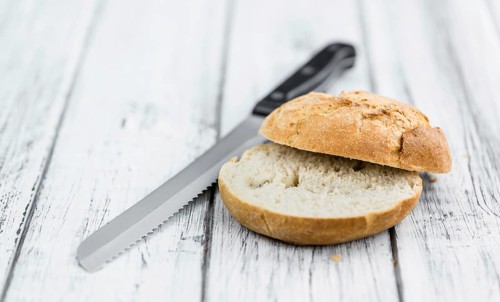 Rolls (German style) on rustic wooden background as close-up shot