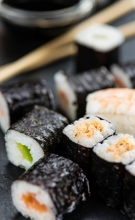 Fresh made Sushi (selective focus) on a vintage looking slate slab