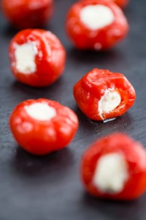 Homemade Filled Pimientos on vintage background (selective focus, close-up shot)