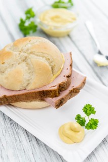 Leberkaese on a vintage background as detailed close-up shot (selective focus)