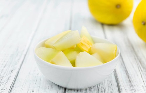 Portion of fresh made Honeydew Melon (close-up shot, selective focus)