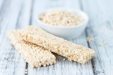 Portion of homemade Quinoa Bars (selective focus, close-up shot)