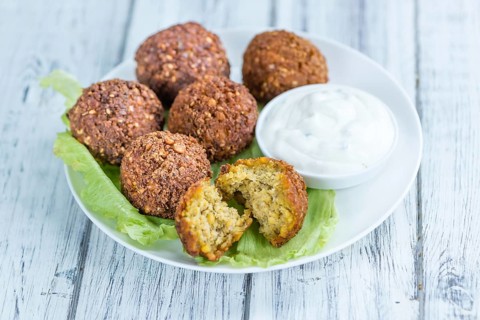 Falafel (close-up shot, selective focus) on an old wooden table