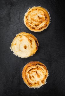Homemade Cheesecake on vintage background (selective focus, close-up shot)