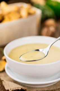 Fresh made Chanterelle Soup on a vintage background as detailed close-up shot