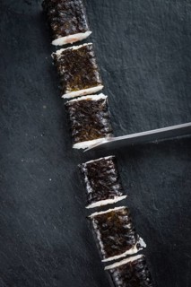 Slate slab with some Sushi (selective focus, close-up shot)