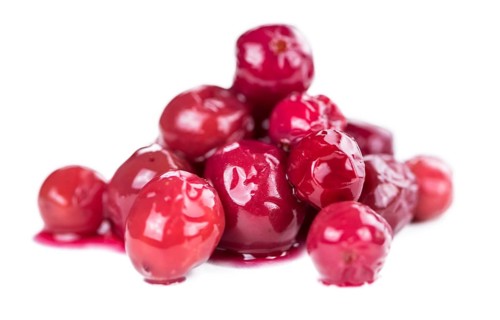 Cranberries (preserved) isolated on white background (selective focus, close-up shot)