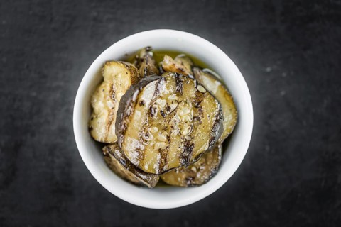 Grilled Zucchinis on a vintage background as detailed close-up shot (selective focus)