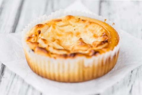 Fresh made Mini Cheesecake on an old and rustic wooden table (selective focus, close-up shot)
