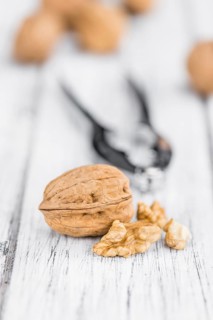 Walnuts on a vintage background as detailed close-up shot (selective focus)