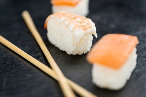 Slate slab with some Sushi (selective focus, close-up shot)