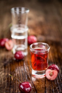 Some homemade Cherry Liqueur as detailed close-up shot, selective focus