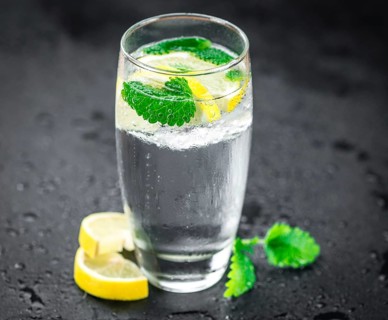 Homemade Lemonade on vintage background (selective focus, close-up shot)