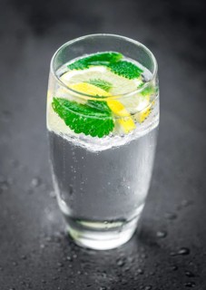 Some Lemonade (with Balm) on a slate slab (close-up shot, selective focus)