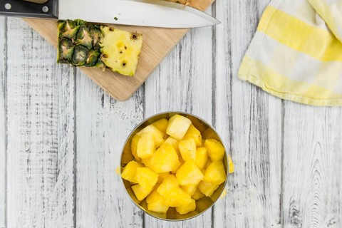 Fresh made Pineapple (sliced) on a vintage background as detailed close-up shot