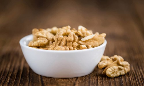 Portion of fresh Walnut kernels (close-up shot, selective focus)