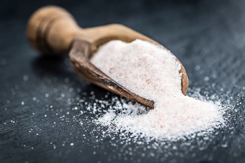 Portion of Himalayan Salt on a rustic slate slab (selective focus, close-up shot)