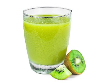 Portion of fresh made Kiwi Smoothie isolated on white background (close-up shot, selective focus)