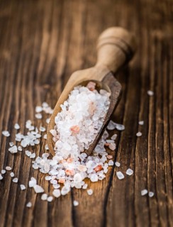 Pink Salt on a vintage background as detailed close-up shot (selective focus)