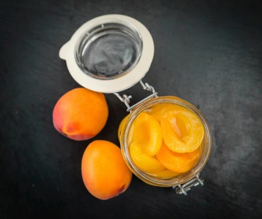 Pickled Apricots on a vintage background as detailed close-up shot (selective focus)