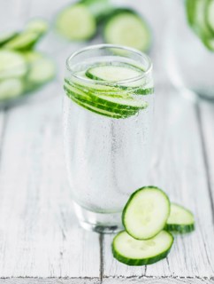 Cucumber Water on a vintage background as detailed close-up shot, selective focus