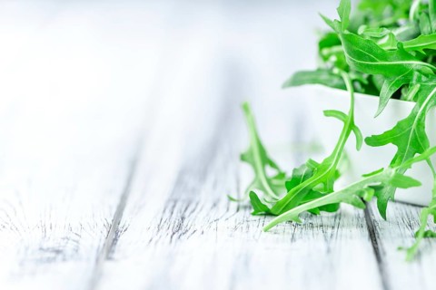 Portion of fresh Arugula (detailed close-up shot, selective focus)