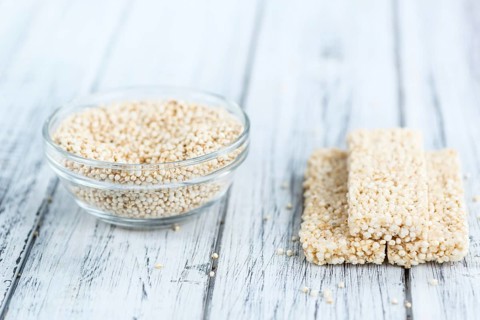 Some fresh made Quinoa Bars on vintage background (close-up shot)