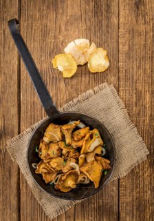 Portion of fresh Fried Chanterelles close-up shot, selective focus