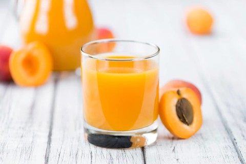 Some homemade Apricot Juice (selective focus) as detailed close-up shot
