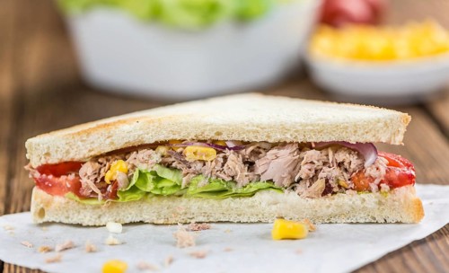 Tuna Sandwich (selective focus, close-up shot) on vintage background