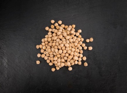 Chickpeas on a vintage background as detailed close-up shot, selective focus