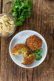 Homemade Falafel (close-up shot, selective focus) on wooden background