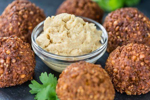 Homemade Falafel (close-up shot, selective focus) on wooden background