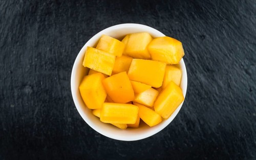 Portion of fresh made Kaki fruits (close-up shot, selective focus)