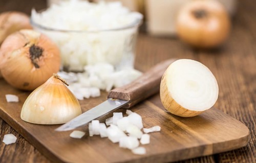 Some homemade White Onions (dices) as detailed close-up shot, selective focus